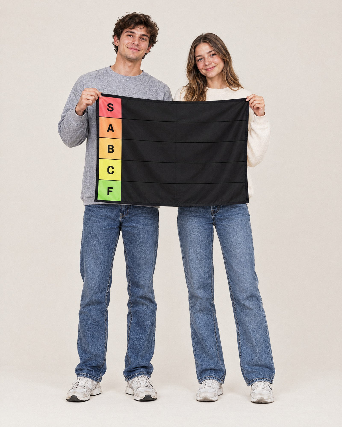 The same two friends holding up the 36 x 26 in Tier Board tapestry, about 3 ft wide