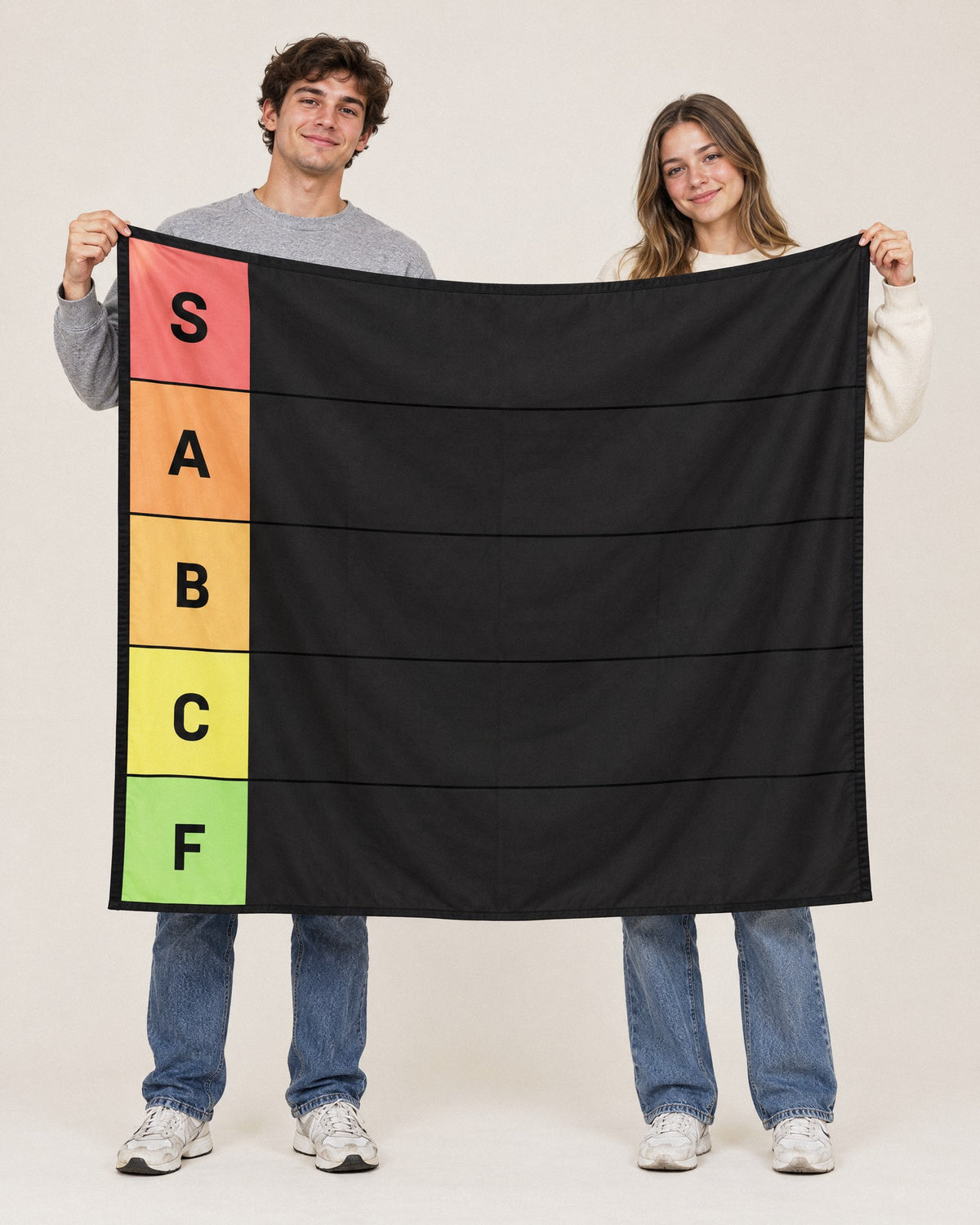 Two friends holding up the XL 60 x 50 in Tier Board tapestry, wider than both of them