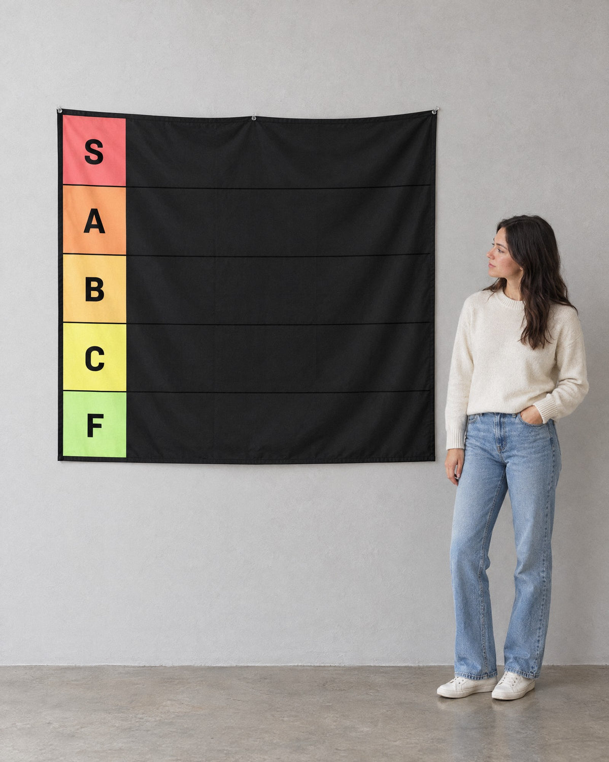 XL 60 x 50 in tier list tapestry on a wall next to a woman for scale, its top above her head